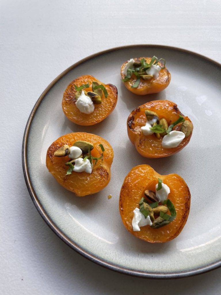 grilled peaches with pistachios and goat cheese