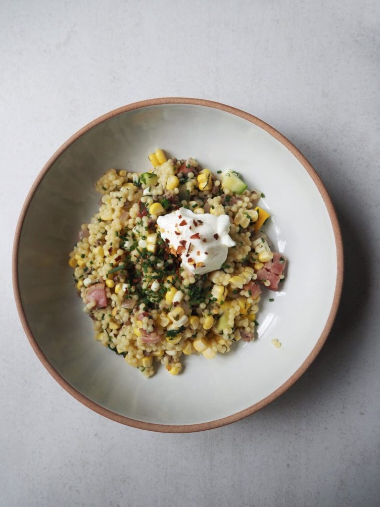 Pastina with zucchini, corn and pancetta